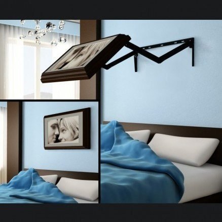 Идея для маленькой спальни - телевизор спрятан под картиной.